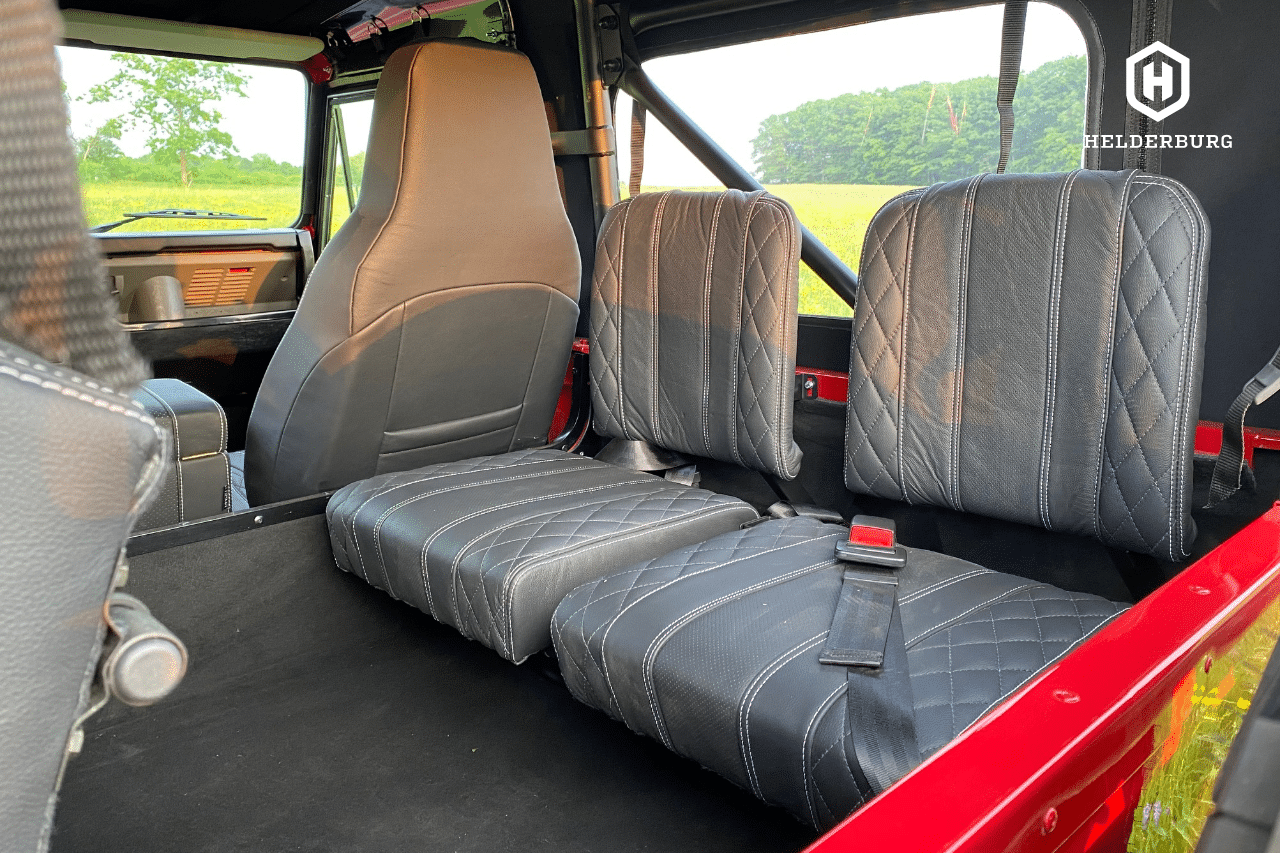 custom defender builds - rear center facing bucket seats in cargo area