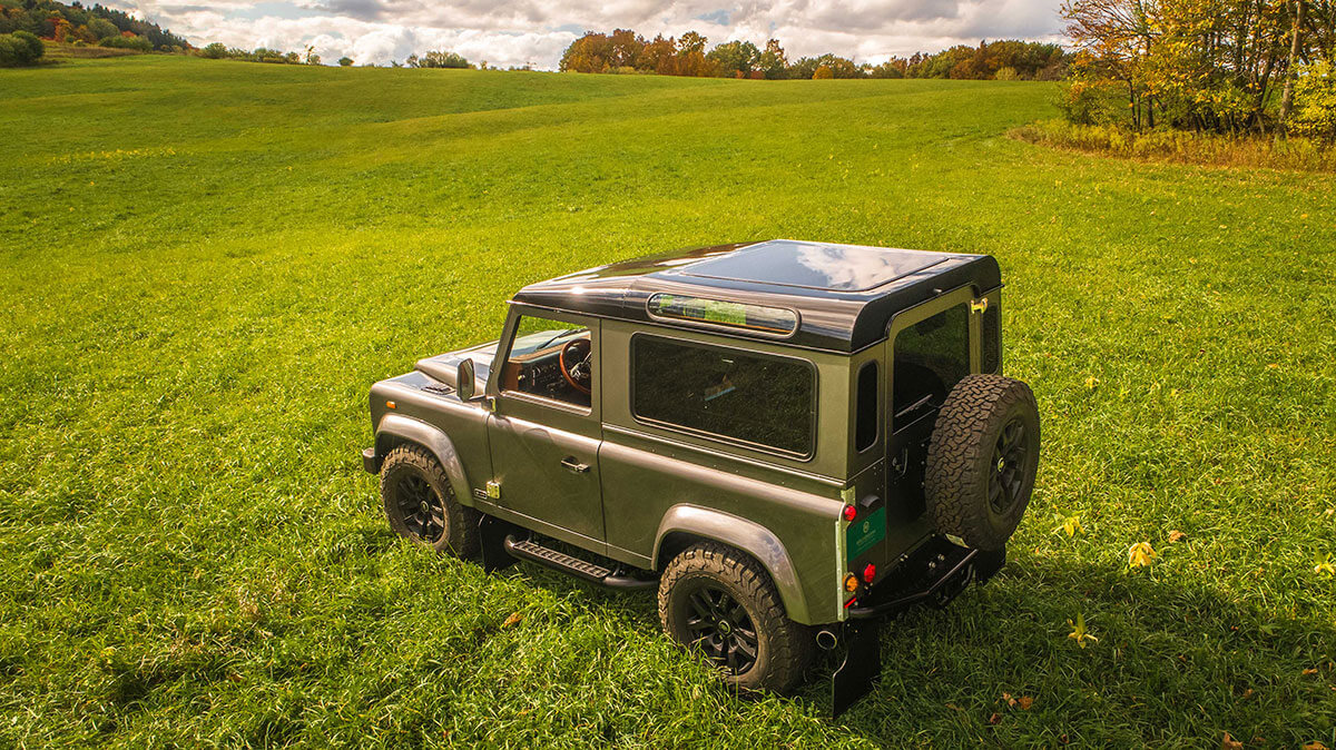Land Rover Defender D90: Exterior Drone Shot 3/4 Rear View