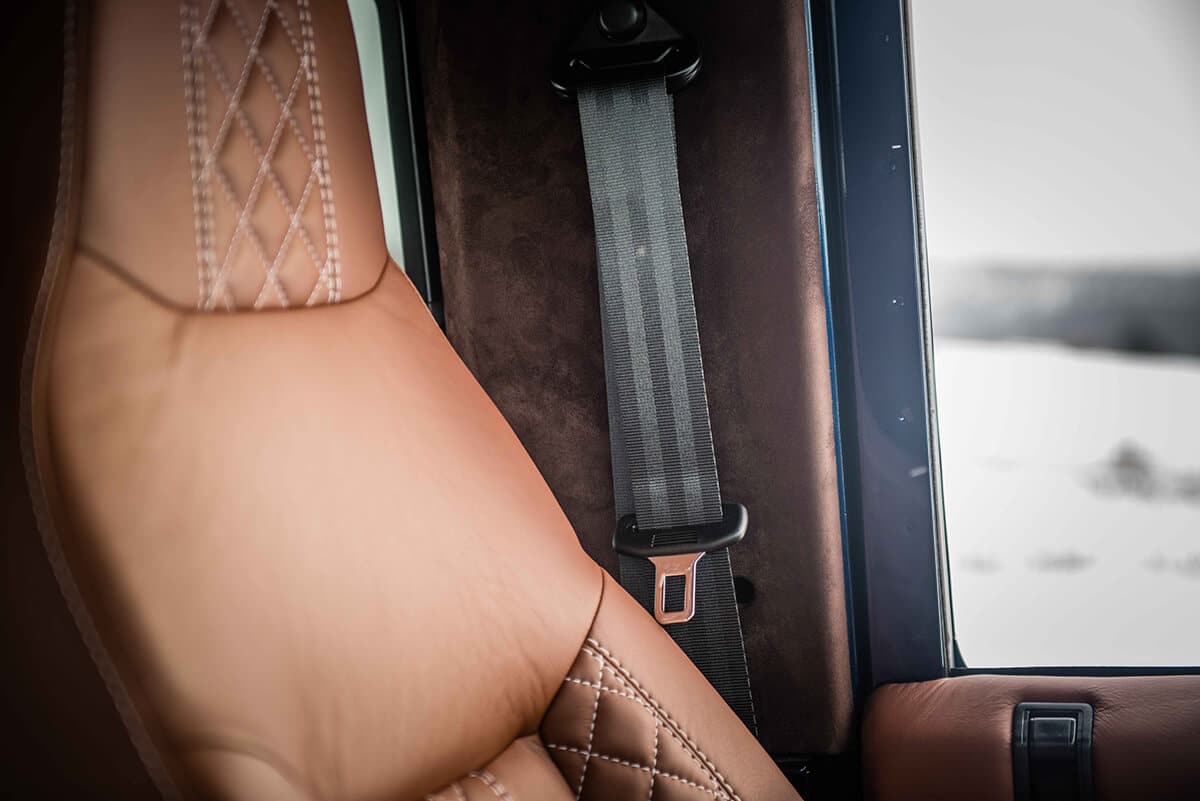 Land Rover Defender D90: Bespoke Leather Chestnut seat with contrast white stitch and quilted pattern