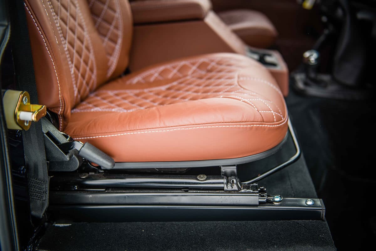 Land Rover Defender D90: Bespoke Leather Chestnut seat with contrast white stitch and quilted pattern