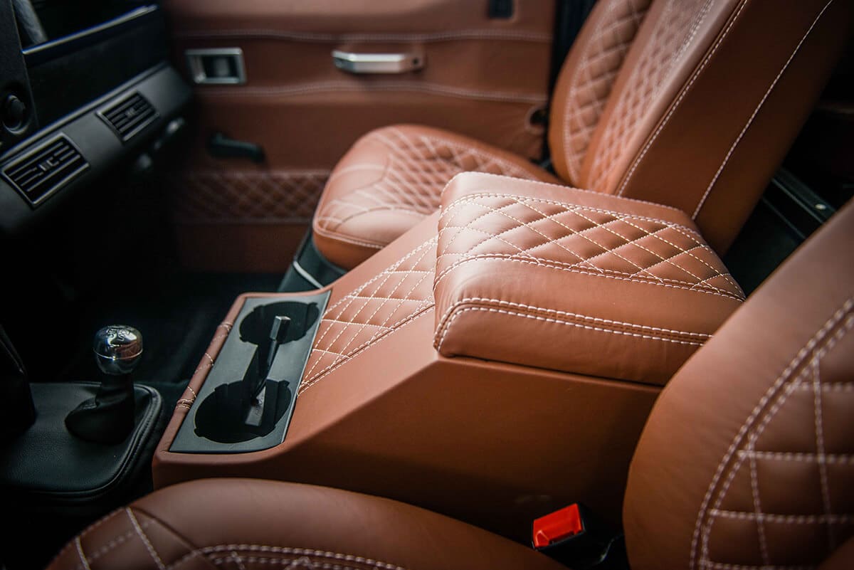 Land Rover Defender D90: Bespoke Leather Chestnut seat with contrast white stitch and quilted pattern