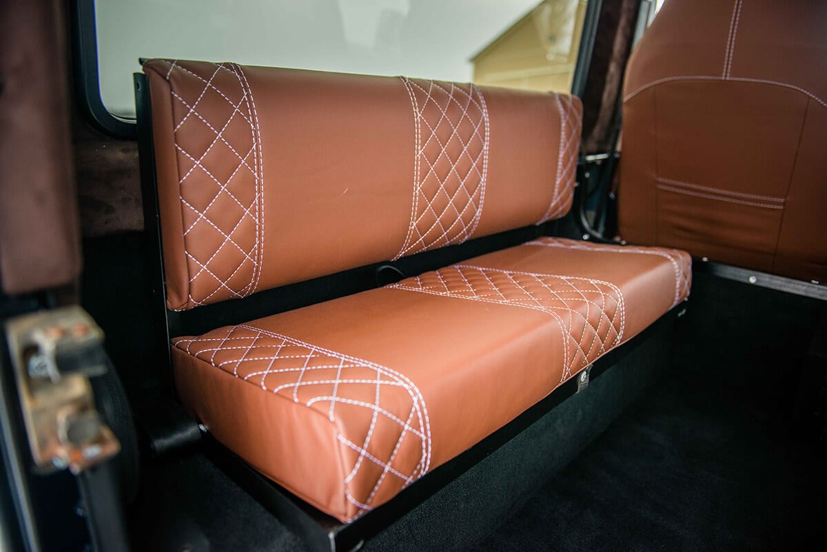 Land Rover Defender D90: Bespoke Leather Chestnut seat with contrast white stitch and quilted pattern