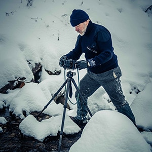 Paul photographing frozen waterfalls