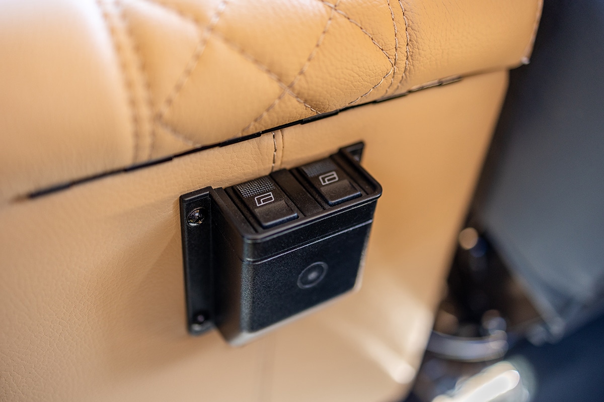 Performance Tuned Land Rover Defender D110: Rear Window Switches on Center Cubby