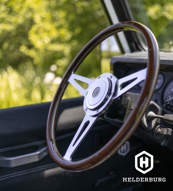 rugged custom defender - wood and chrome steering wheel detail