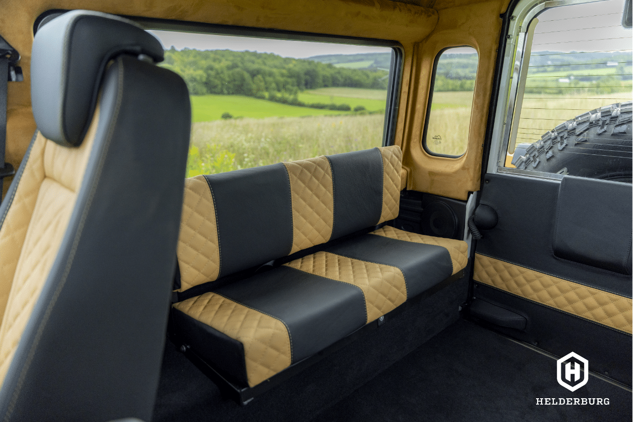 Restored Land Rover Defender 110 - center facing rear bench seats in cargo area