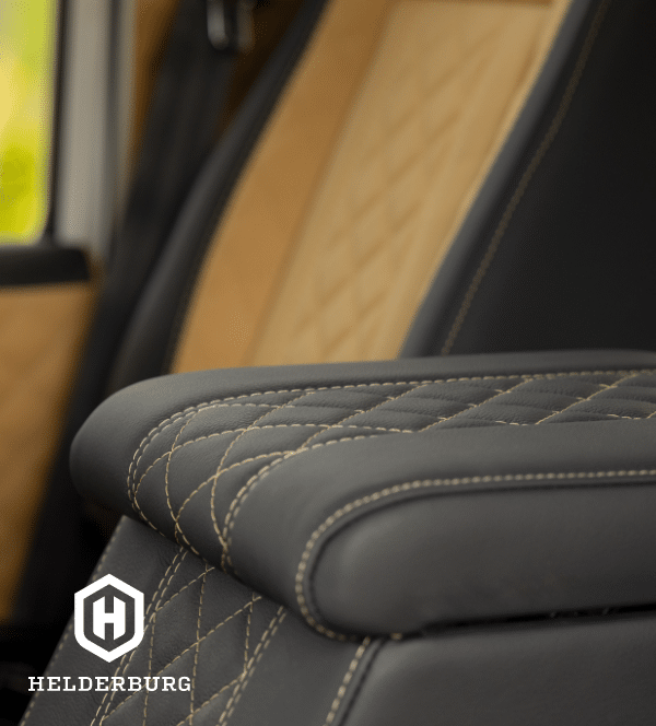 Restored Land Rover Defender 110 - second row leather seating and storage detail